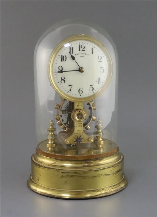 A Eureka & Co. Ltd, London. A gilt brass and steel electric timepiece Height including dome 13in.